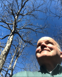 Ron looking up at trees