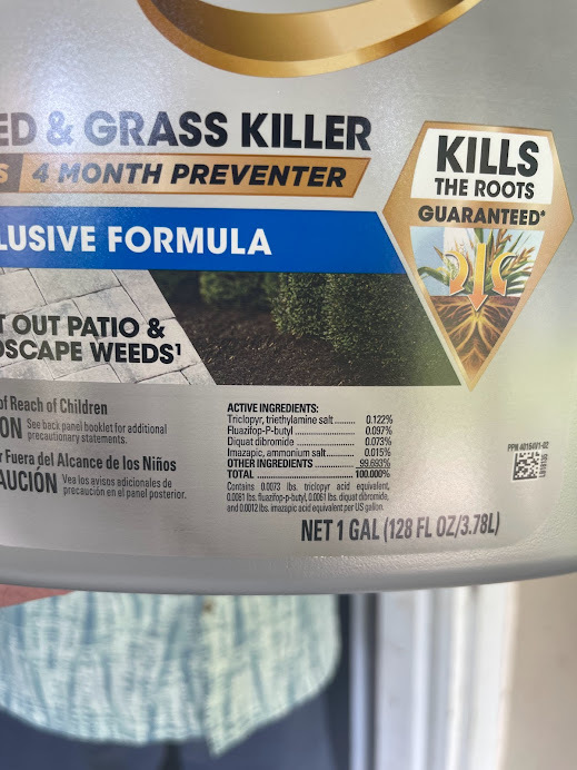 Kills the Roots Guaranteed logo on Weed and Grass Killer packaging