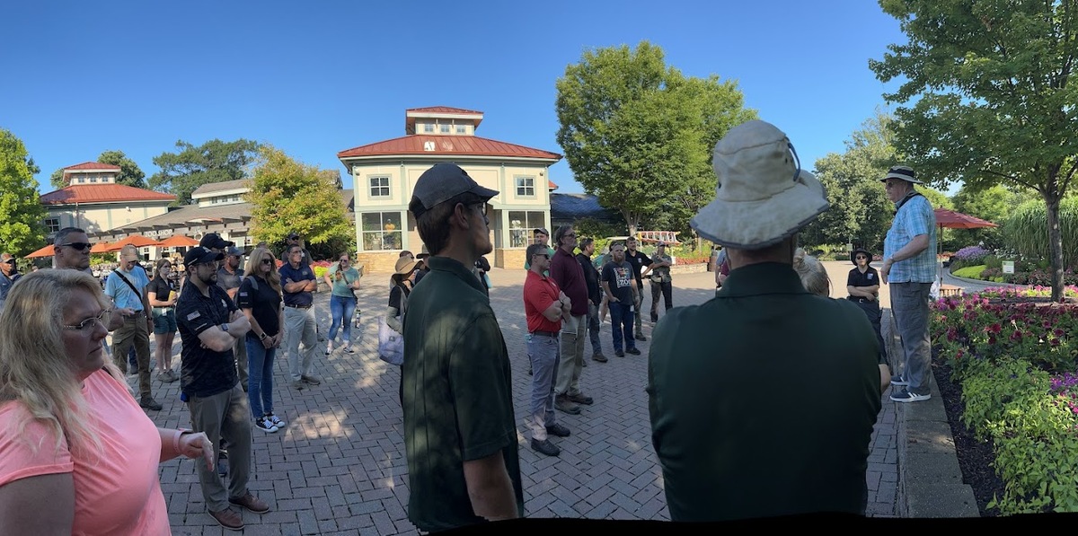 person speaking at front of crowd