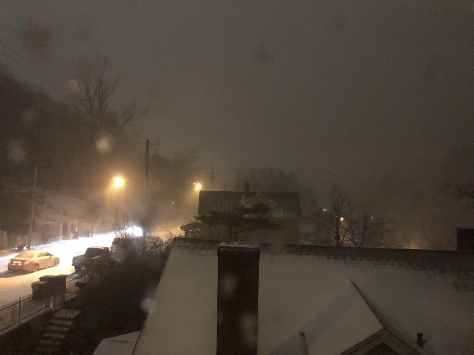 snow on ground and rooftops